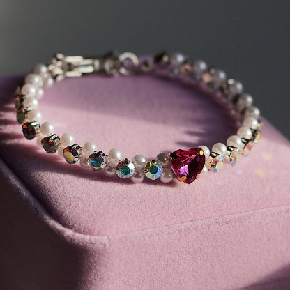 Bleikt hjartaarmband og eyrnalokkar
